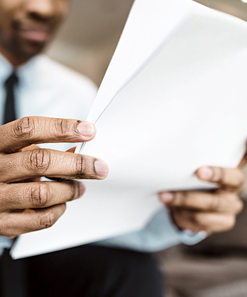 man looking to papers